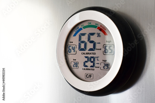 Digital thermometer hygrometer on the wall.