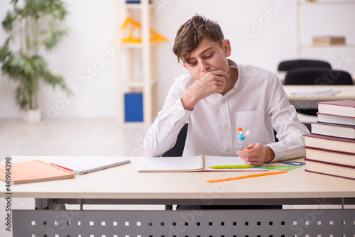 Boy stadying chemistry in the classrom