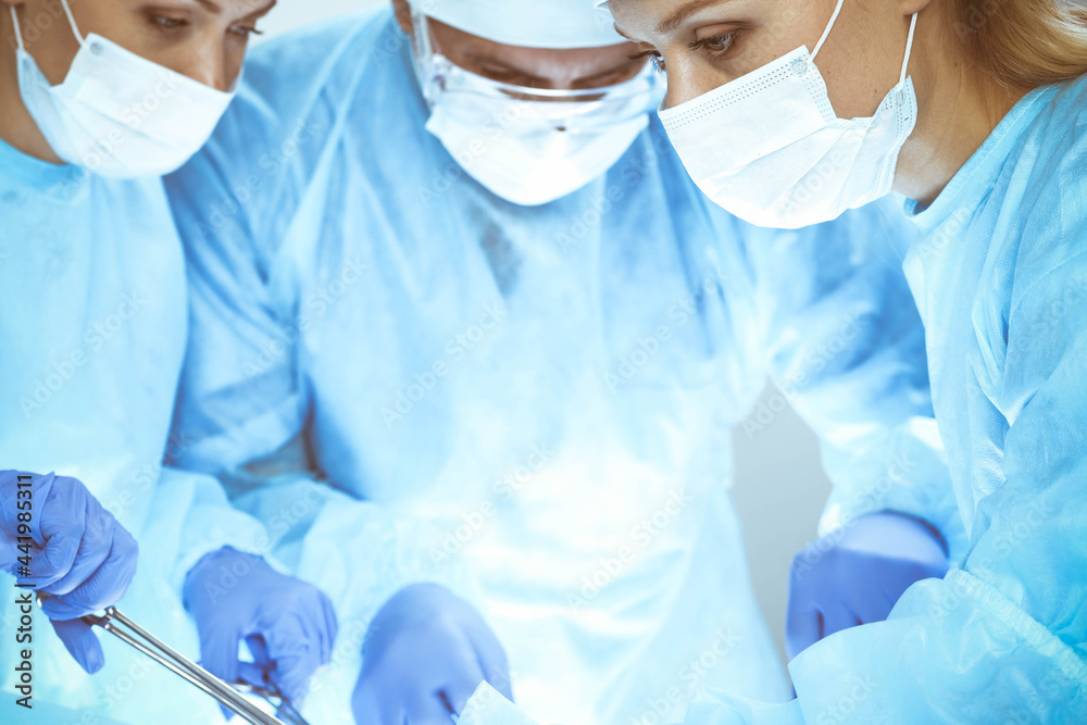 A group of surgeons is operating at the hospital. Health care concept A group of surgeons is operating at the hospital. Health care concept