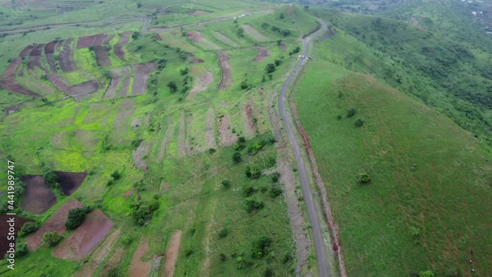 Aerial view of greenery during the monsoon season in the countryside near Pune India. Monsoon is the annual rainy season in India from June to September. Aerial view of greenery during the monsoon season in the countryside near Pune India. Monsoon is the annual rainy season in India from June to September.