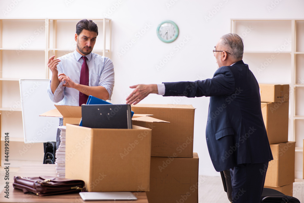 Two male employees in relocation concept Two male employees in relocation concept
