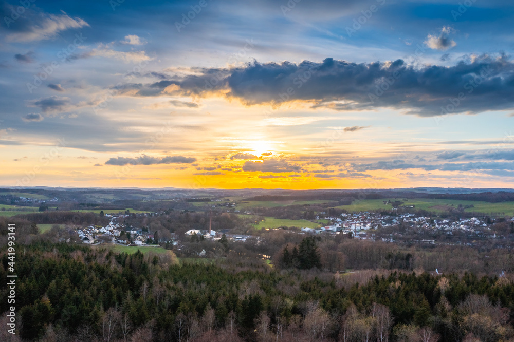 Sunset, Aerial view over forests and meadows of Westerwald, Altenkirchen, Germany