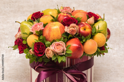 Gift floral fruit bouquet on light background