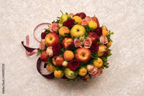 Gift floral fruit bouquet on light background