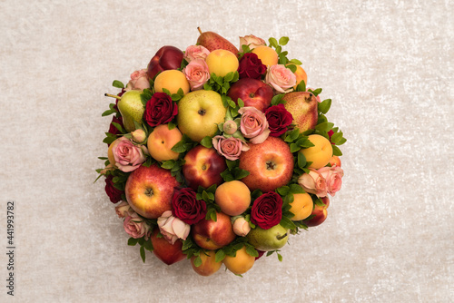 Gift floral fruit bouquet on light background