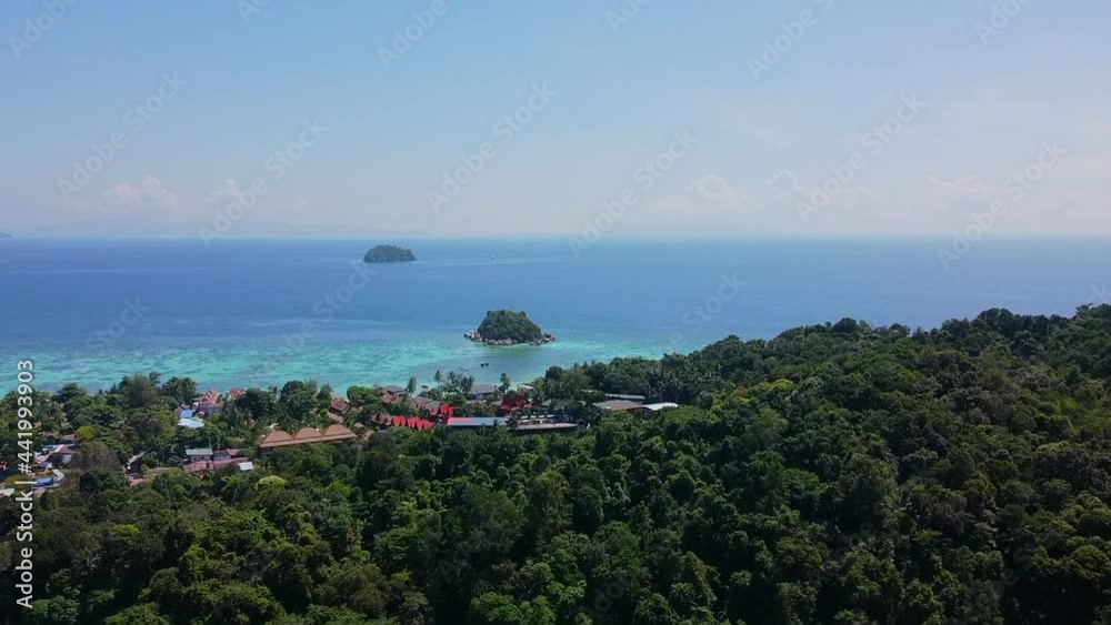 Aerial Drone View of Small Islands, Ko Lipe, Thailand. Tropical Coast Panoramic Landscape, Sea Beach, Hot Summer Day. Coconut Palm Trees, Jungle from Above. Birds View on Tourist Resort Aerial Drone View of Small Islands, Ko Lipe, Thailand. Tropical Coast Panoramic Landscape, Sea Beach, Hot Summer Day. Coconut Palm Trees, Jungle from Above. Birds View on Tourist Resort