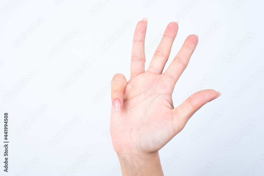 hands with pink manicure over white background showing with fingers number four. hands with pink manicure over white background showing with fingers number four.