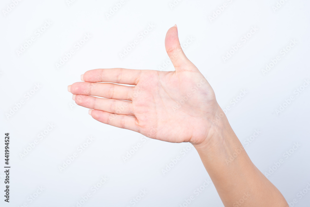 hand holding something on the palm, hand isolated over white background greeting someone saying hello with thumb up. Hand pointing aside hand holding something on the palm, hand isolated over white background greeting someone saying hello with thumb up. Hand pointing aside