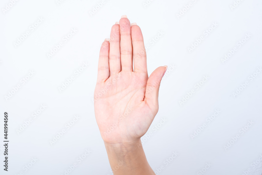 woman's palm raised up showing stop sign. woman's palm raised up showing stop sign.