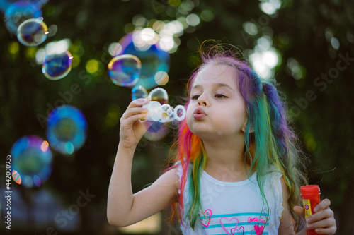 adorable, beautiful, birthday, blow, blue, bright, bubble, caucasian, celebration, cheerful, child, childhood, city, color, cute, enthusiastic, face, fashion, fun, girl, green, happiness, happy, holid
