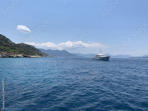 ship in the sea in Greece near island with blue sky © timarowland