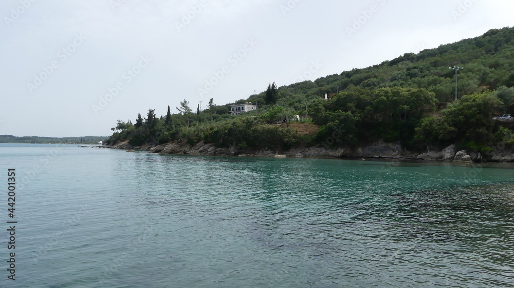 Tropical land and turquoise ocean in greece taken from the sea Tropical land and turquoise ocean in greece taken from the sea