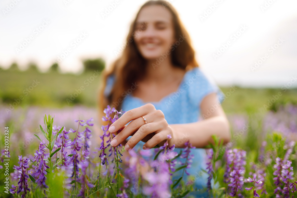 Portrait of beautiful woman in amazing in a blooming field. Nature, vacation, relax and lifestyle. Summer landscape. Portrait of beautiful woman in amazing in a blooming field. Nature, vacation, relax and lifestyle. Summer landscape.