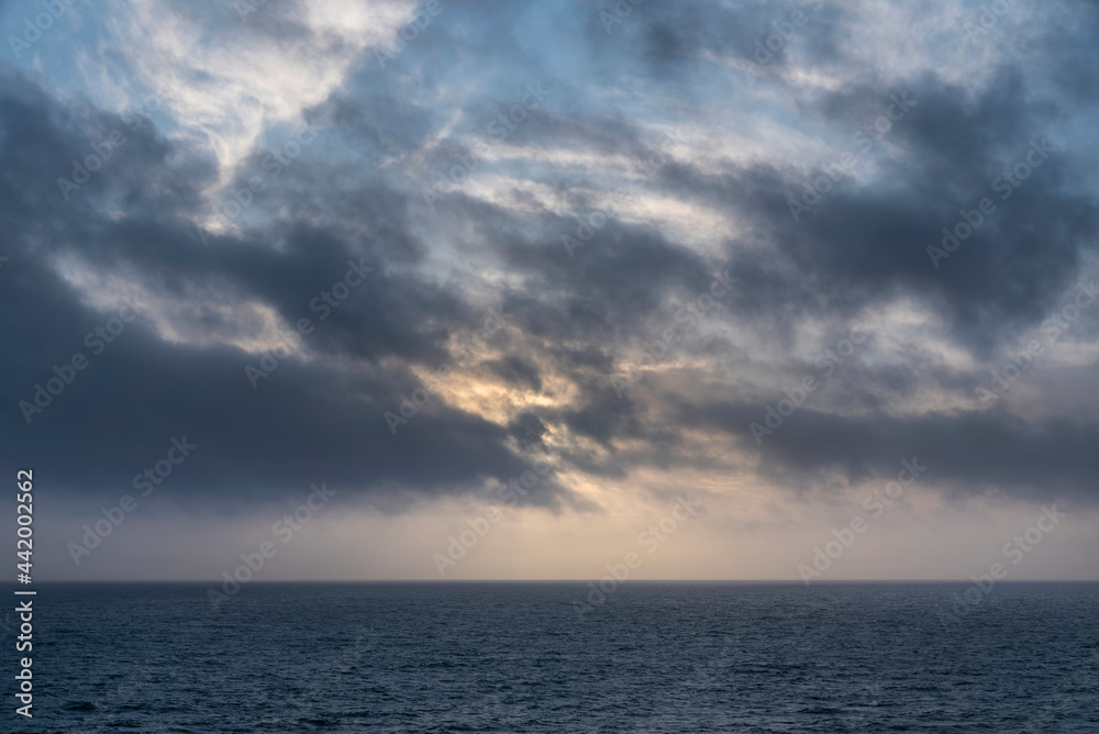 Stunning fine art landscape image of view from Hartland Quay in Devon England durinbg moody Spring sunset