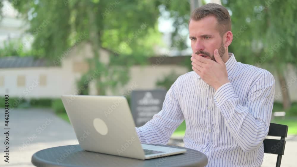 Socked Middle Aged Man with Laptop having Loss Socked Middle Aged Man with Laptop having Loss