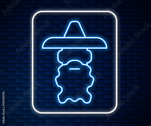 Glowing neon line Wizard warlock icon isolated on brick wall background. Vector