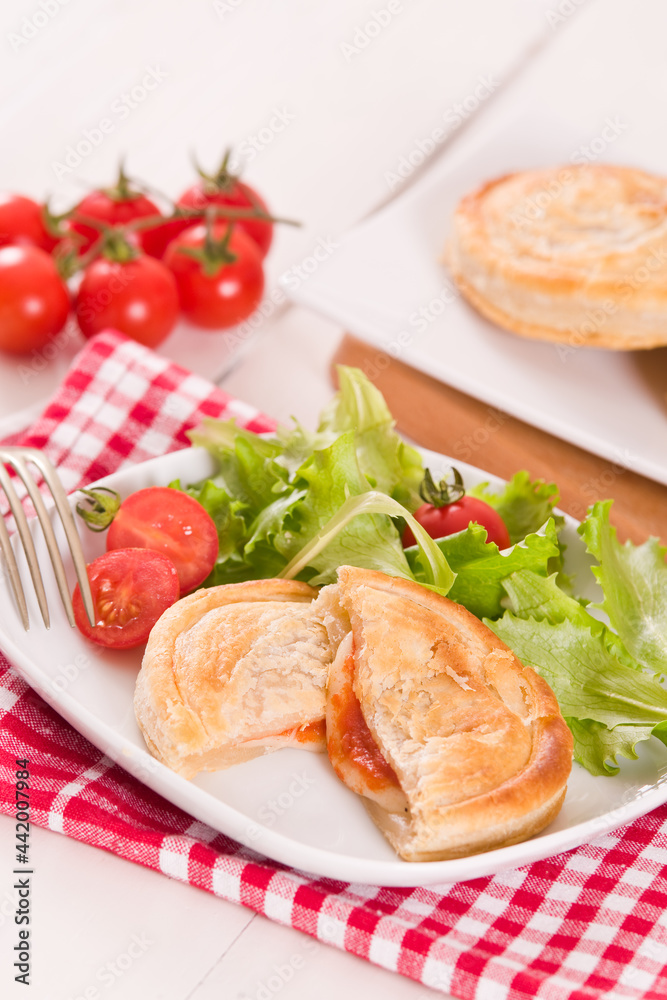 Puff pastry filled with tomato and mozzarella cheese. Puff pastry filled with tomato and mozzarella cheese.