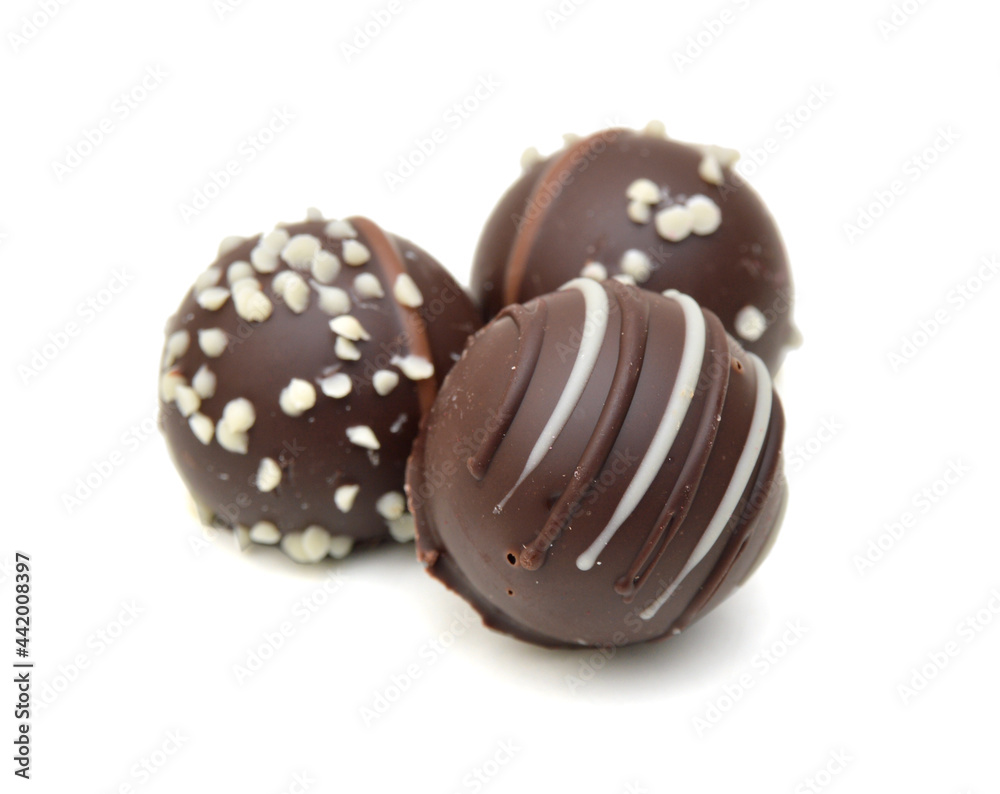 Chocolate candies collection. Beautiful Belgian truffles isolated on white background Chocolate candies collection. Beautiful Belgian truffles isolated on white background
