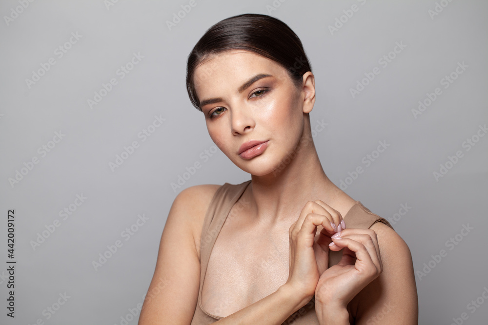 Nice woman showing heart shape, studio beauty portrait Nice woman showing heart shape, studio beauty portrait
