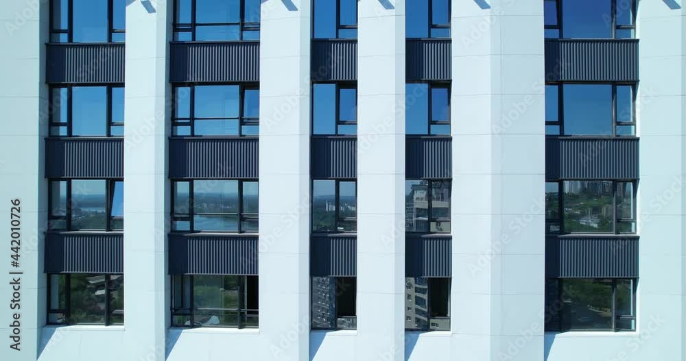 The facade of a modern multi-storey building. The facade of a modern multi-storey building.