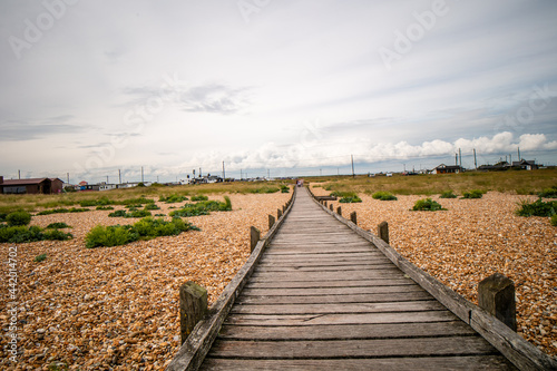 Fototapeta Naklejka Na Ścianę i Meble -  The boardwalk to the sea at Dungeness National nature reserve, in Kent. 