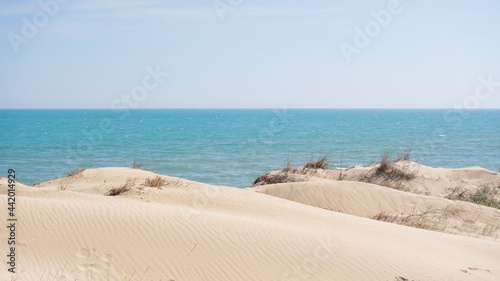 Dunas white sand hills near blue sea. High quality photo