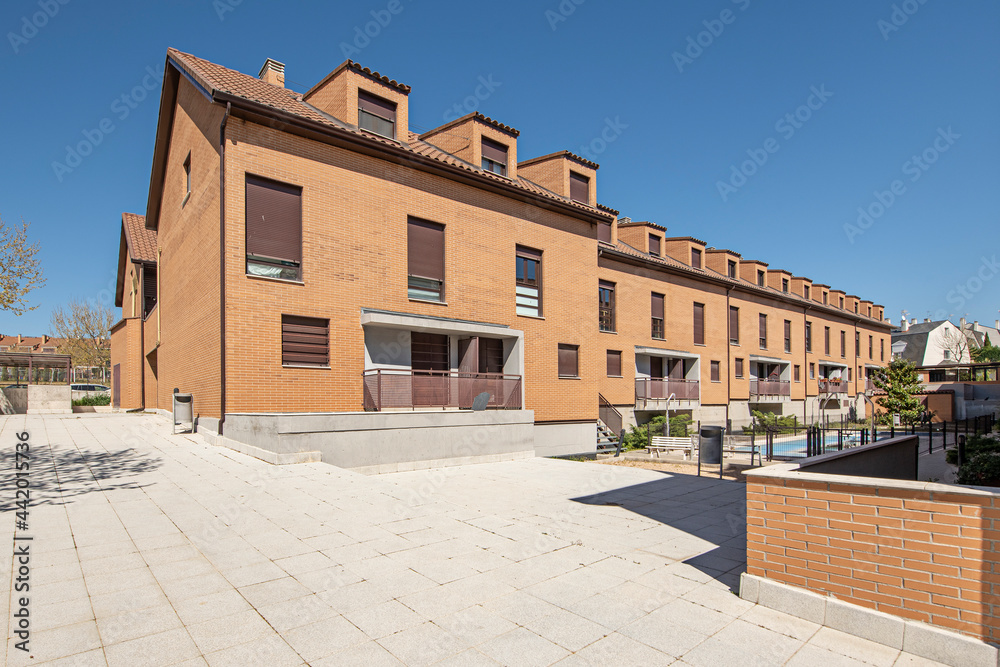 Common areas and swimming pool of a community of neighbors of single-family homes in a suburb of Madrid Common areas and swimming pool of a community of neighbors of single-family homes in a suburb of Madrid