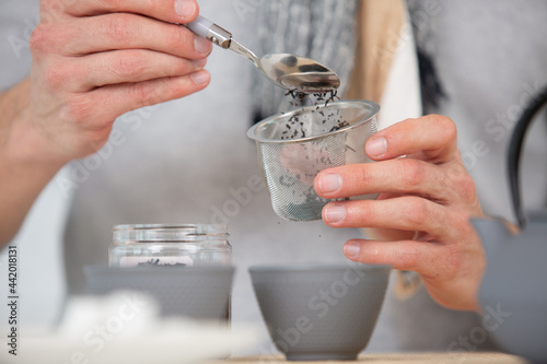 woman hands preparing hot tea
