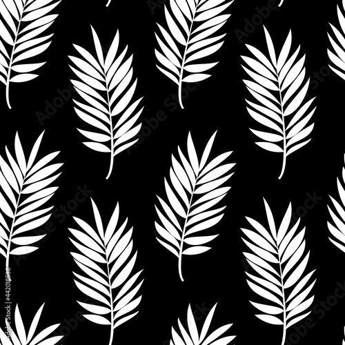 White branches of a palm tree on a black background. Seamless modern pattern for textiles, trendy fabrics, bed linen, decorative pillows, photo wallpaper, interior design. 