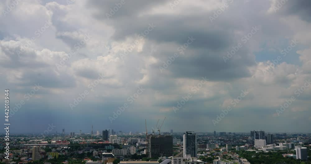 time lapse of gray clouds over the city on sunny day time lapse of gray clouds over the city on sunny day