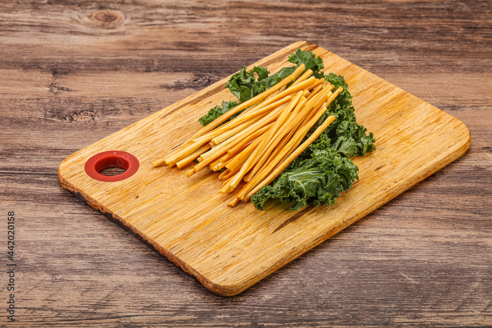 Chechel cheese sticks over board