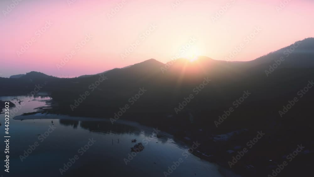 Aerial slow flight over evening beach island. Nature archipelago is hilly jungle bay. Organization excursions, natural light. Geographical paradise colorful landscape. Sunset on Corfu Greece backlit. Aerial slow flight over evening beach island. Nature archipelago is hilly jungle bay. Organization excursions, natural light. Geographical paradise colorful landscape. Sunset on Corfu Greece backlit.