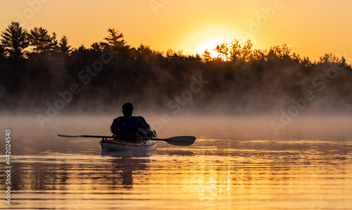 A kayaker at sunrise 