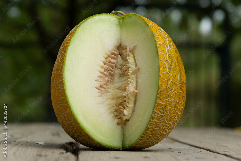 Fresh melon on wooden table, healthy food.