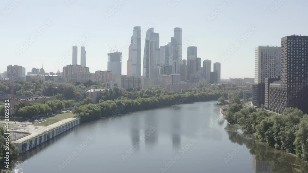 view of the famous business center-Moscow-City across the river at dawn. view of the modern city of Moscow. filmed in a flat profile D-log. aerial view view of the famous business center-Moscow-City across the river at dawn. view of the modern city of Moscow. filmed in a flat profile D-log. aerial view