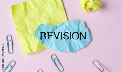 Word writing text Revision. Business concept for action of revising over someone like auditing or accounting Red bubble copy space paper on the table.