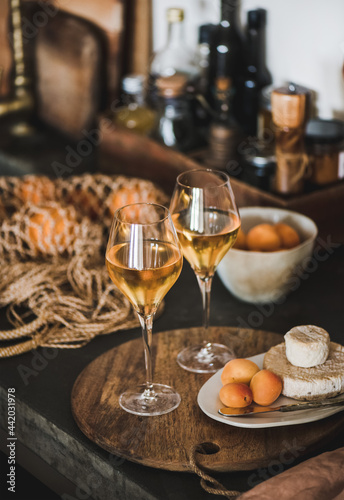 Trendy Orange or Amber wine, apricots and cheese © sonyakamoz