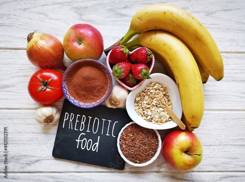 Assortment of foods high in prebiotics for healthy gut and digestive system. Prebiotics rich foods to aid digestion and gut health. Natural food sources of prebiotics for good gut bacteria. photo