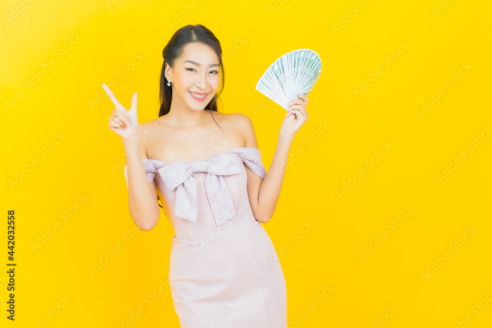 Portrait beautiful young asian woman smile with a lot of cash and money Portrait beautiful young asian woman smile with a lot of cash and money