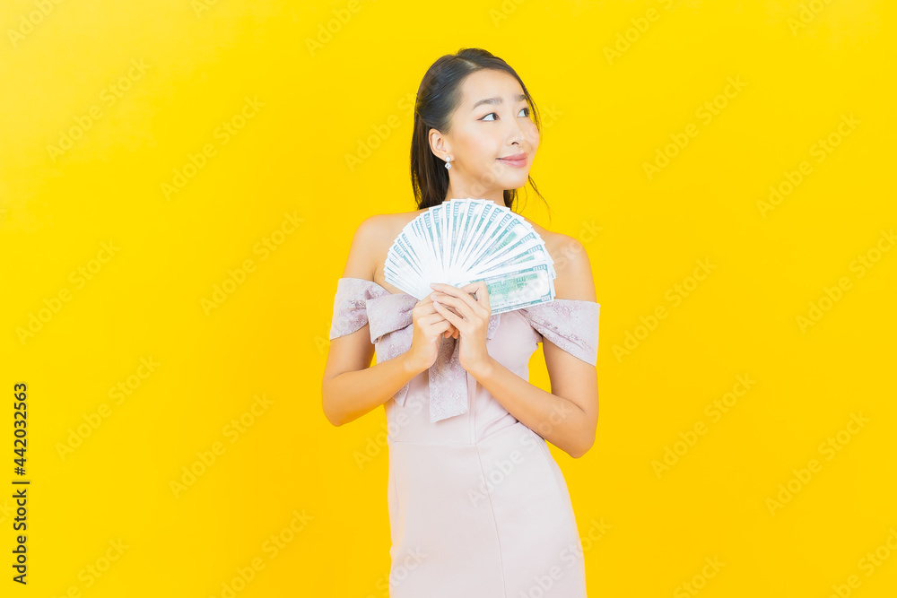 Portrait beautiful young asian woman smile with a lot of cash and money Portrait beautiful young asian woman smile with a lot of cash and money