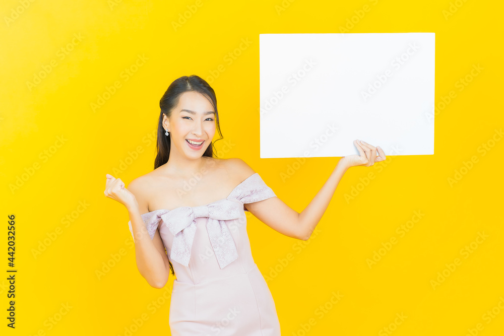 Portrait beautiful young asian woman with empty white billboard Portrait beautiful young asian woman with empty white billboard