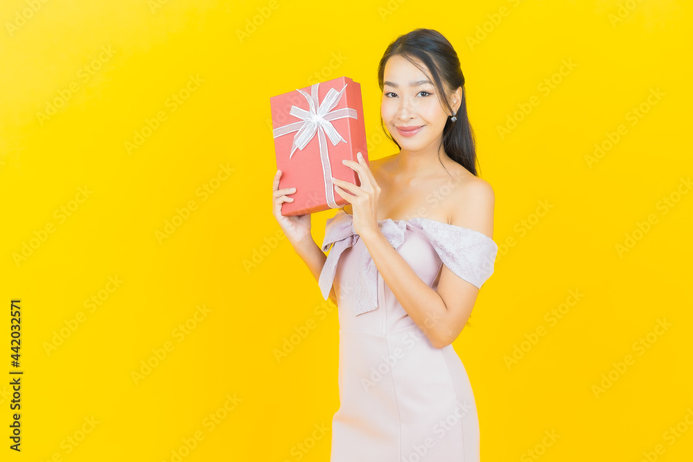 Portrait beautiful young asian woman smile with red gift box Portrait beautiful young asian woman smile with red gift box