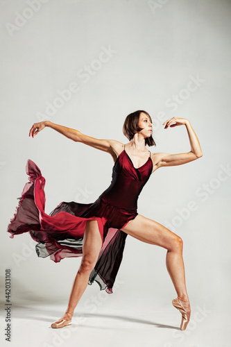 ballerina with a waving red dress