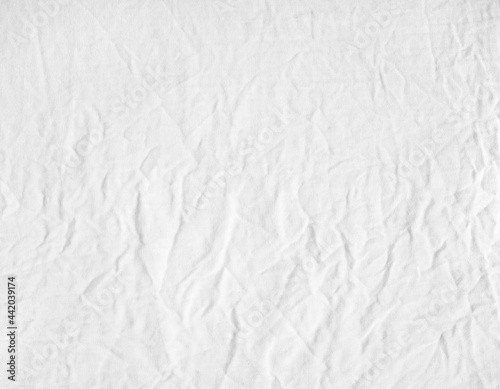 High detailed photo of white fabric crumpled canvas.
