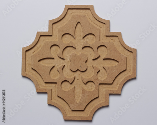 CNC shaped pattern composed of wood. CNC on a white background reveals details. For wall display or table decoration. cnc mockups.