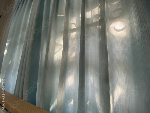 light in the window, curtains 