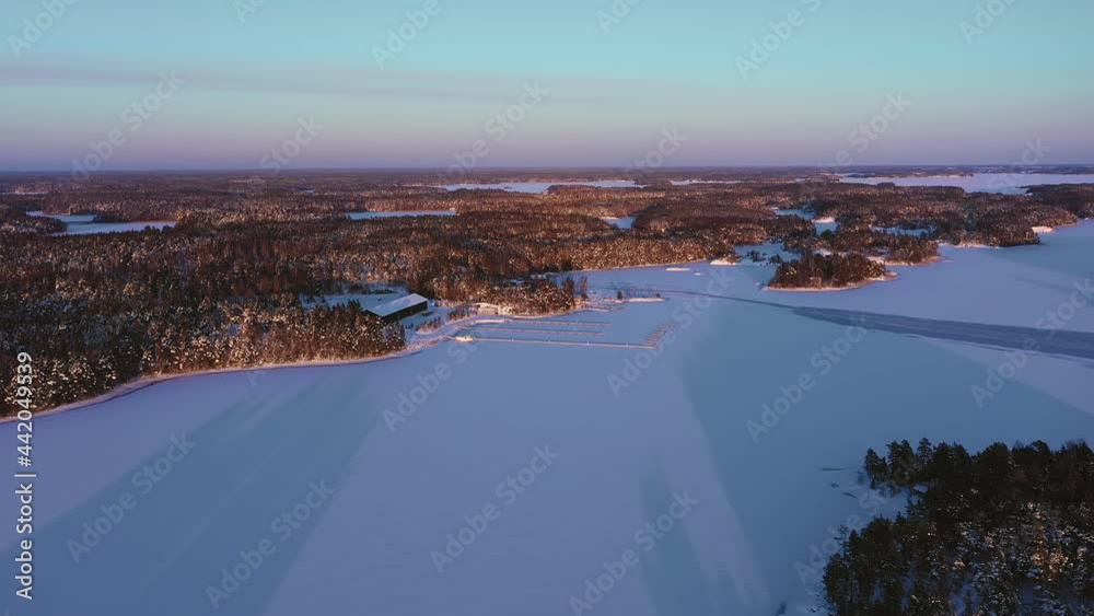 Aerial View of Winter Finnish Archipelago Island Soaked in Golden Sunrise Light Aerial View of Winter Finnish Archipelago Island Soaked in Golden Sunrise Light