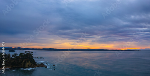 Cloud covered aerial sunrise seascape over the cove © Merrillie