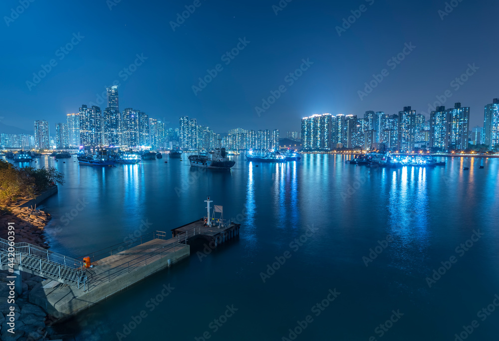 Night scenery of harbor and skyline of Hong Kong city