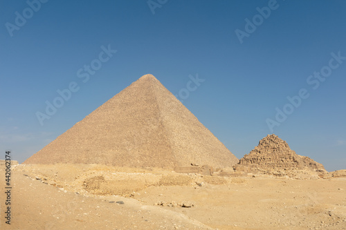 Big light pyramid in mysterious Egypt with the blue sky on the background.